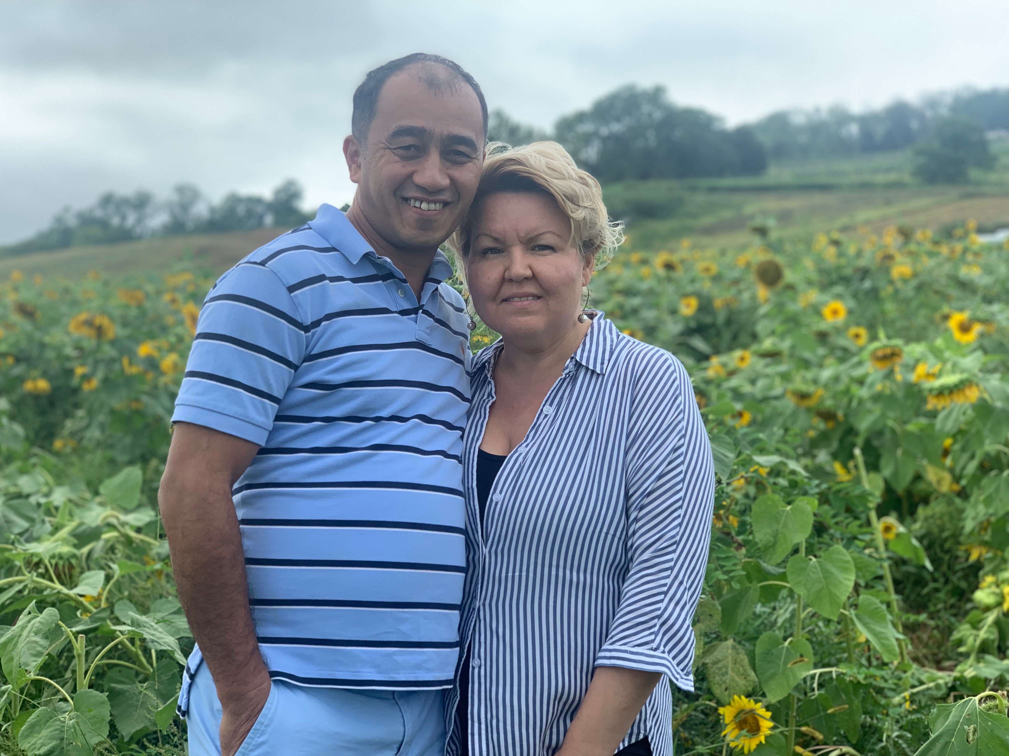 Akop and Svetlana in a sunflower field